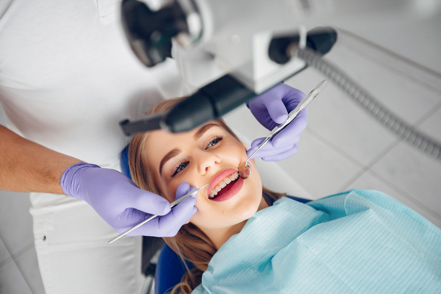 A person getting treated in the dentist's office.